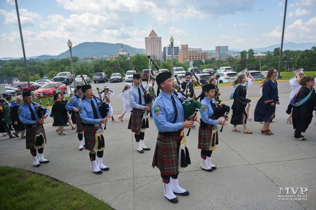 Kendall Giles playing bagpipes at the Roanoke Catholic School Graduation Ceremony